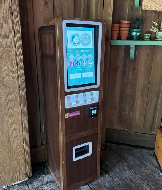 The medallion machine at Tiana's Bayou Adventure
